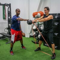 Our Programs - Adult Functional Training OR About Us - Coach Dave (KB Swith with RB)