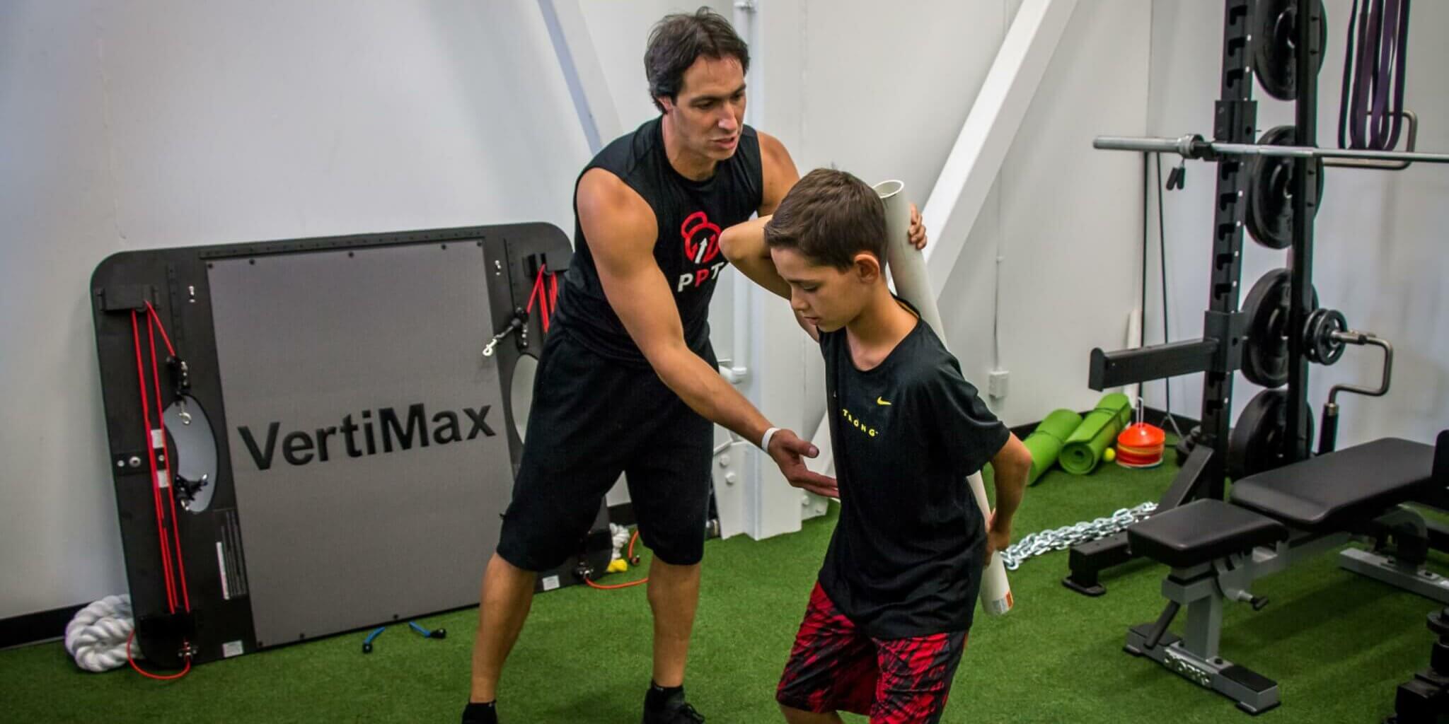 Our Programs - Youth and Teen Functional Training (Hip Hinge with Dowel)