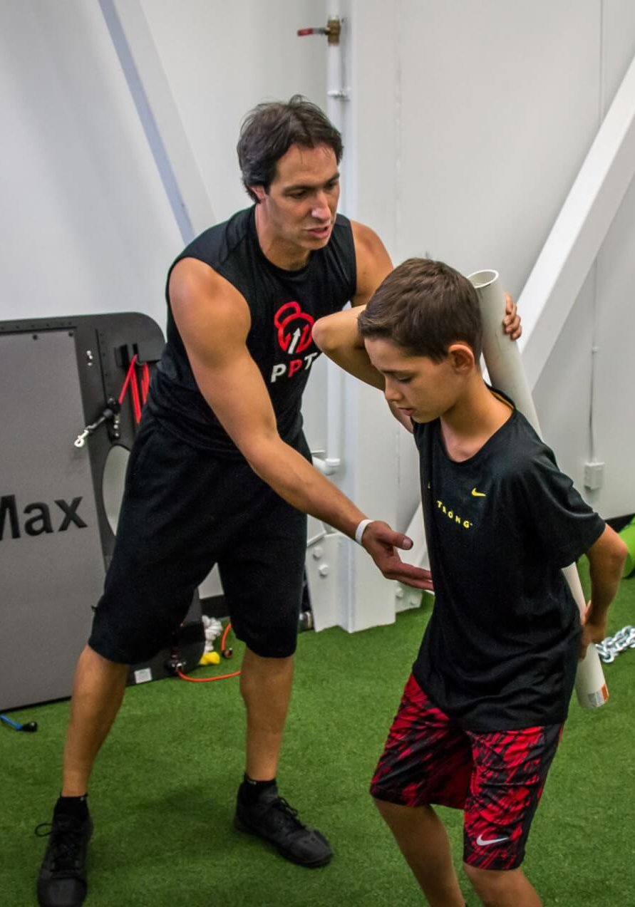 Our Programs - Youth and Teen Functional Training (Hip Hinge with Dowel)